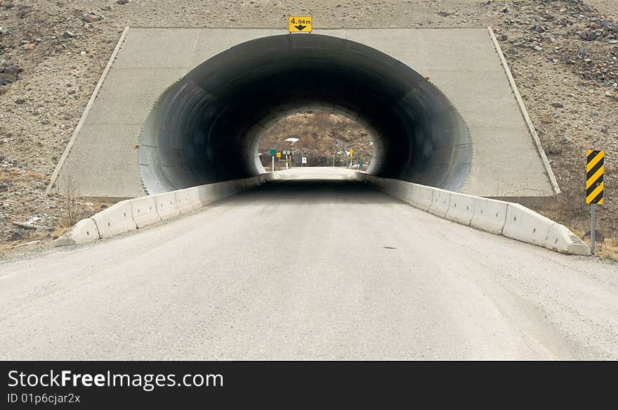 An underpass enabling vehicles to cross under one side of a highway to another. An underpass enabling vehicles to cross under one side of a highway to another