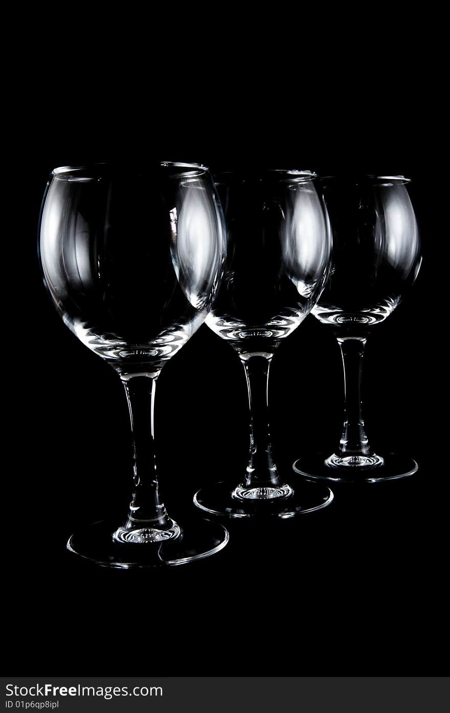 Empty cocktail glasses on black