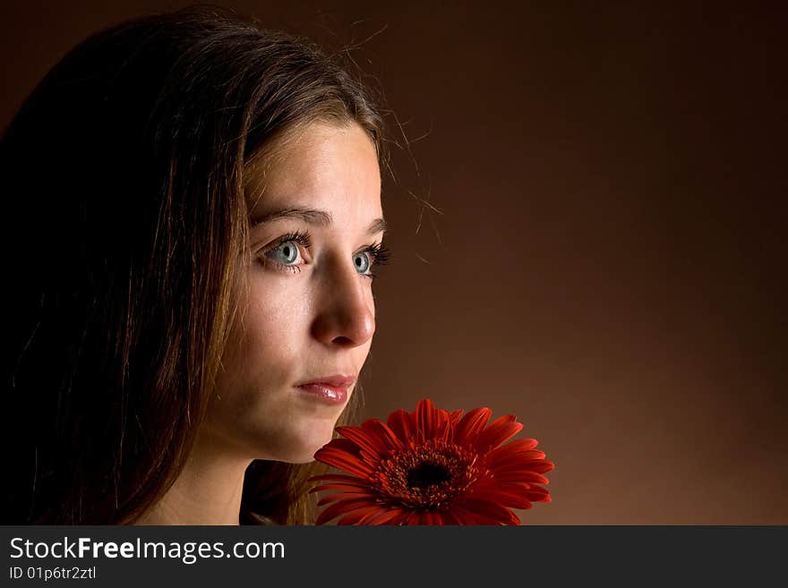 Young Woman With A Red Flower