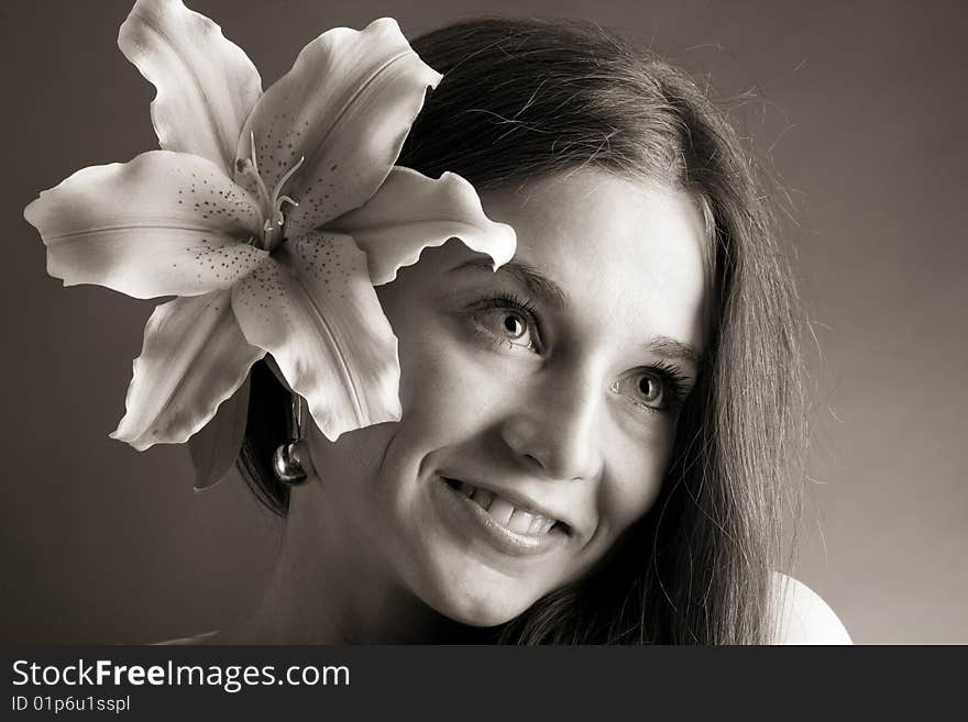 Young woman posing with a lily