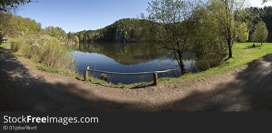 Outdoor panorama with lake and rocks