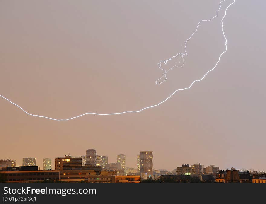 A rendering of a lightning strike with buildings on background