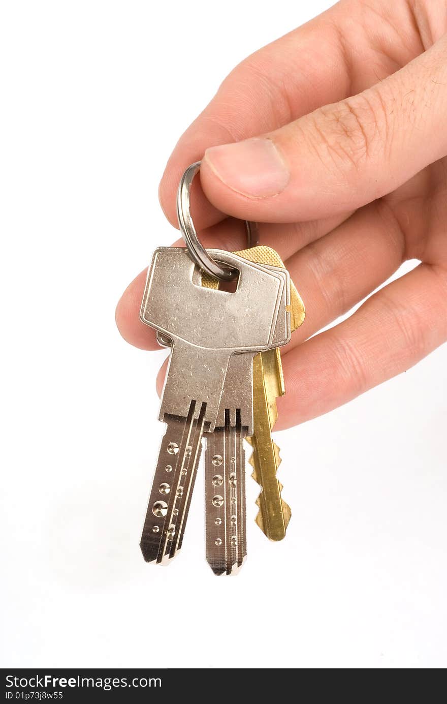 Hand holding keys - isolated on white background