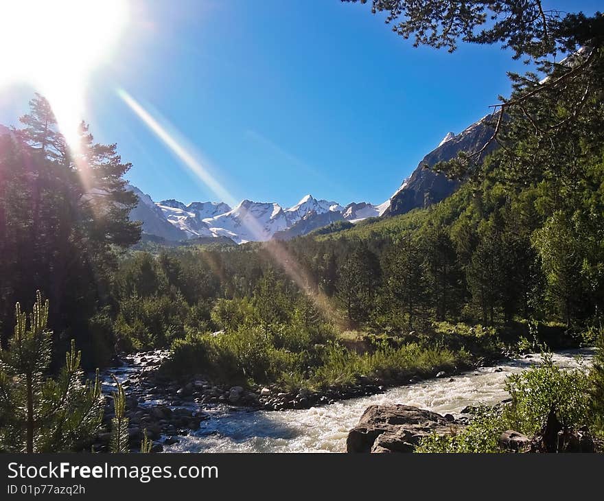 River high in the mountains in summer on a clear day