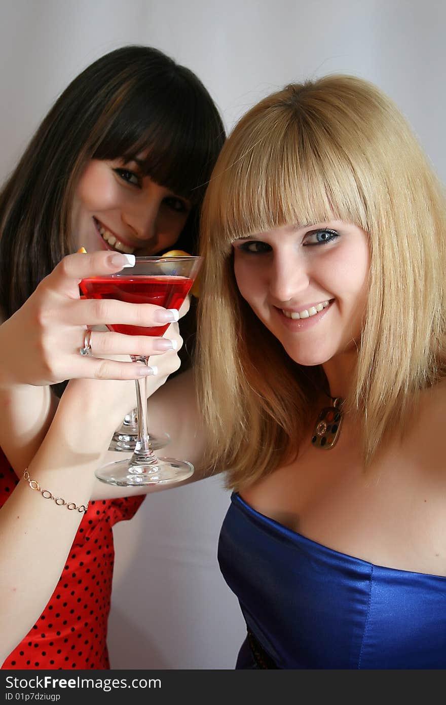 Two pretty friends with cocktail