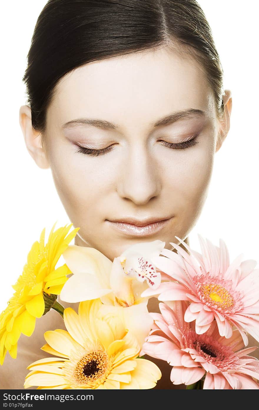 Portrait of young woman with several flowers. Portrait of young woman with several flowers