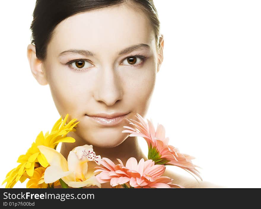 Portrait of young woman with several flowers. Portrait of young woman with several flowers