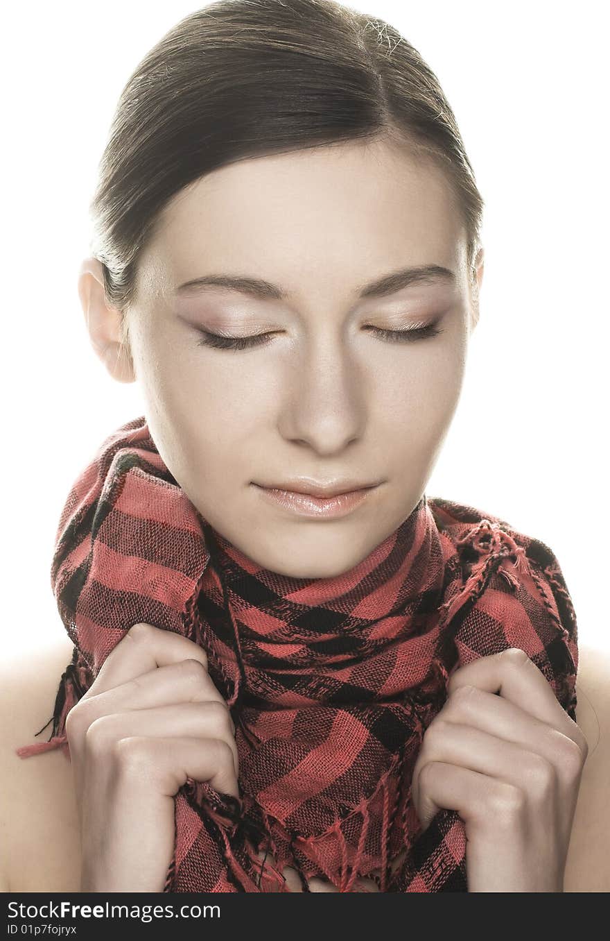 Portrait of  pretty young woman in pink and black scarf