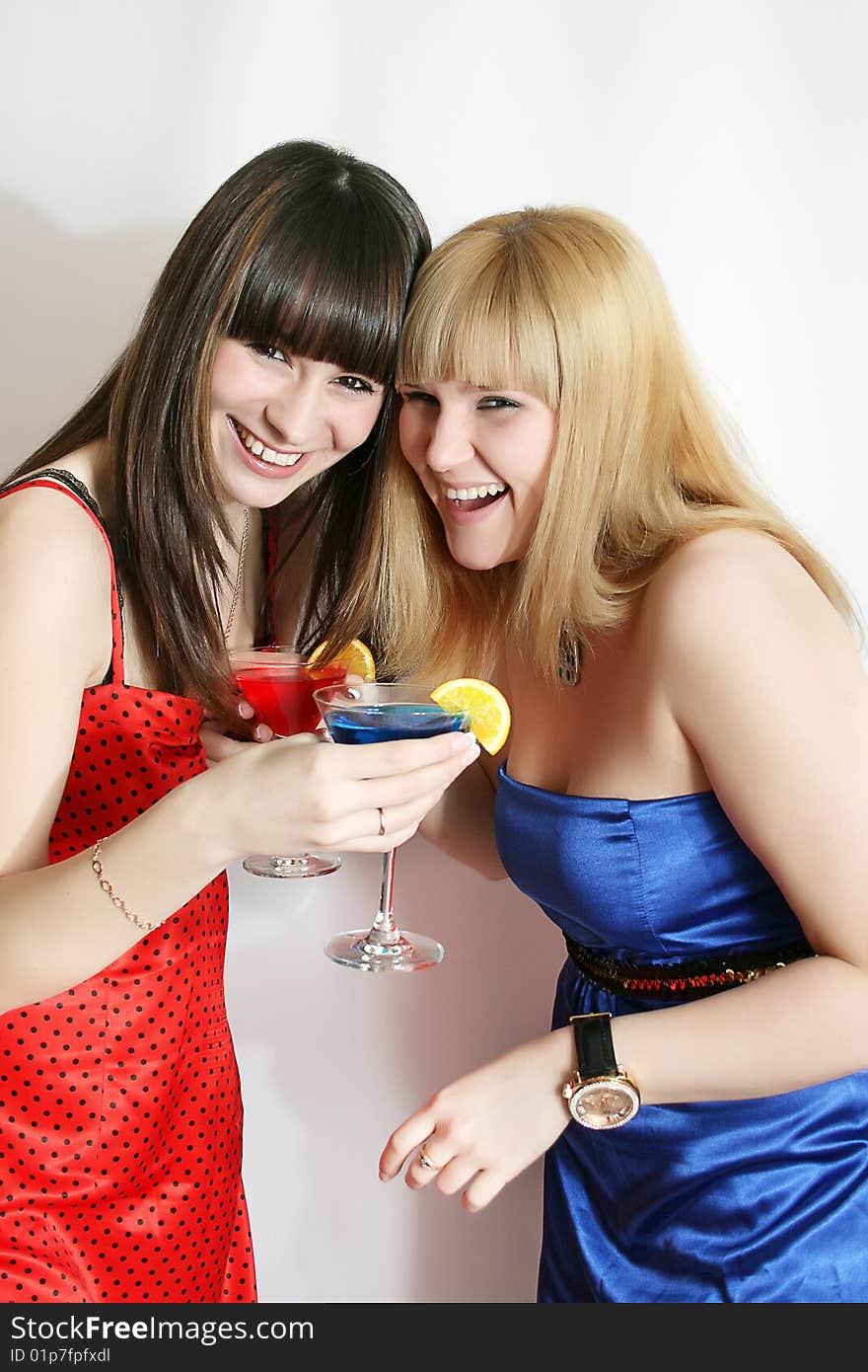 Two pretty friends with cocktail