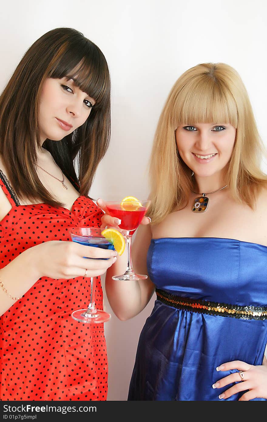 Two pretty friends with cocktail