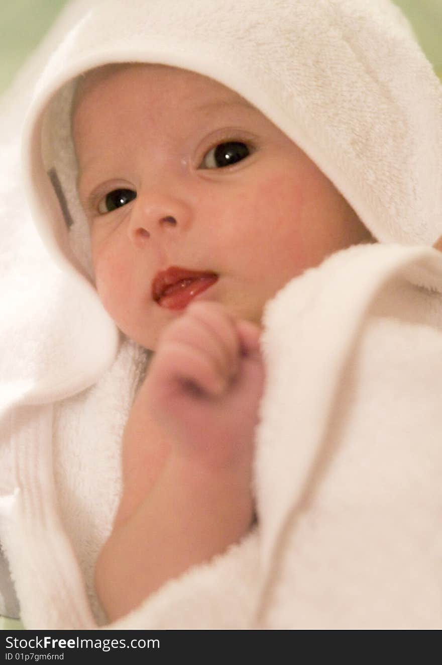 Three-month old baby girl in towel