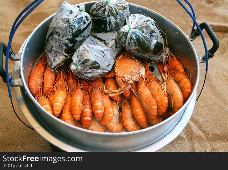 Royal prawns in aluminum saucepan on song