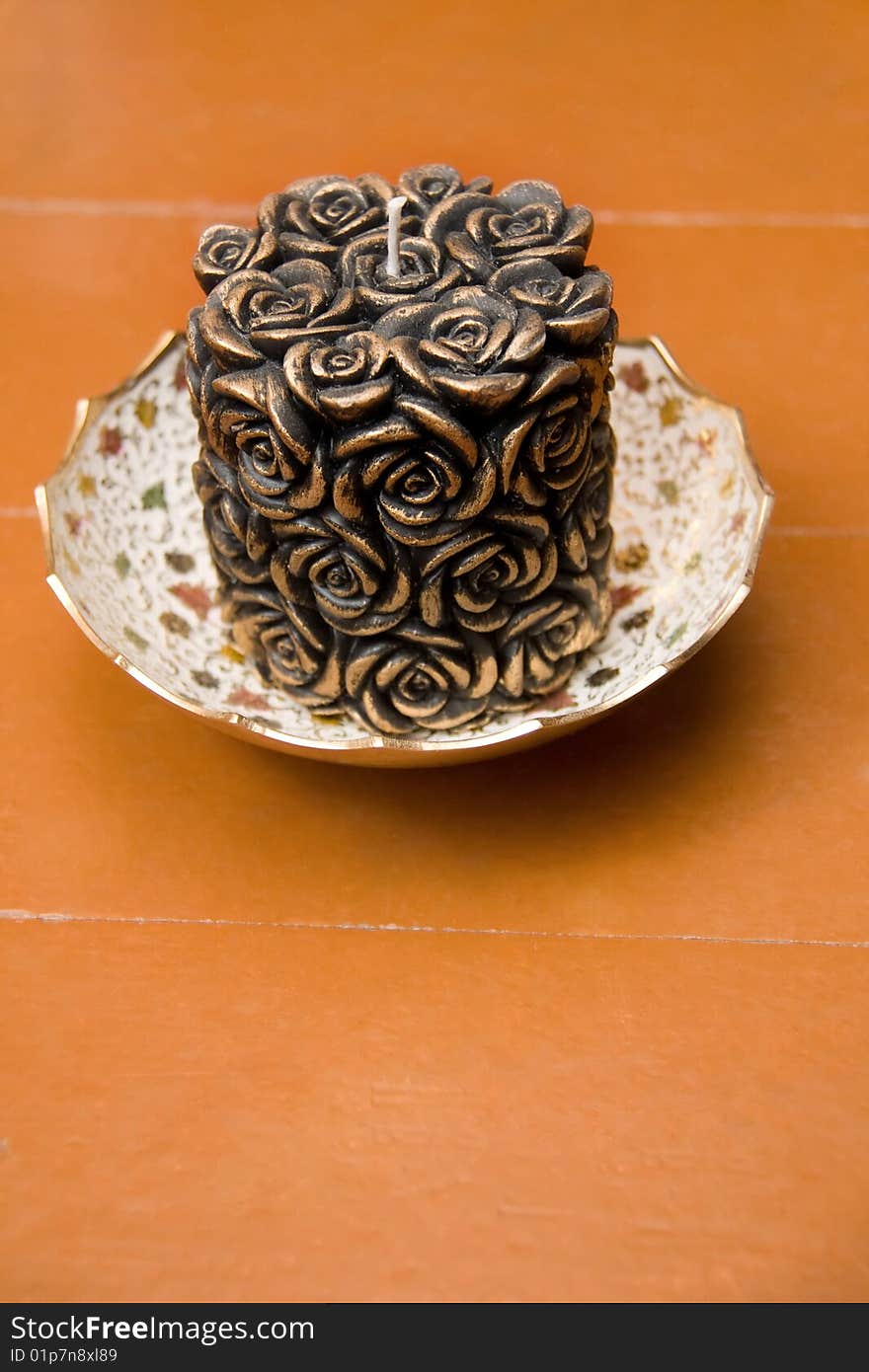 Carved Candle in Ornamental Saucer