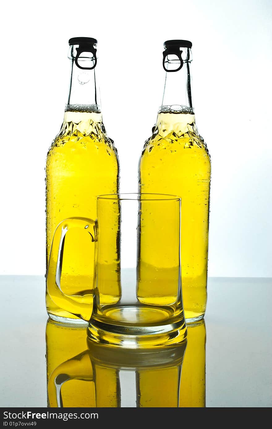 Two beer bottles with liquid