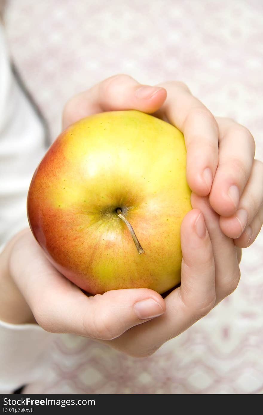 Large Yellow Apple in Hands