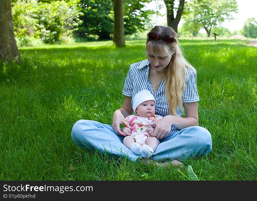 Baby in Mother s Lap Outdoors