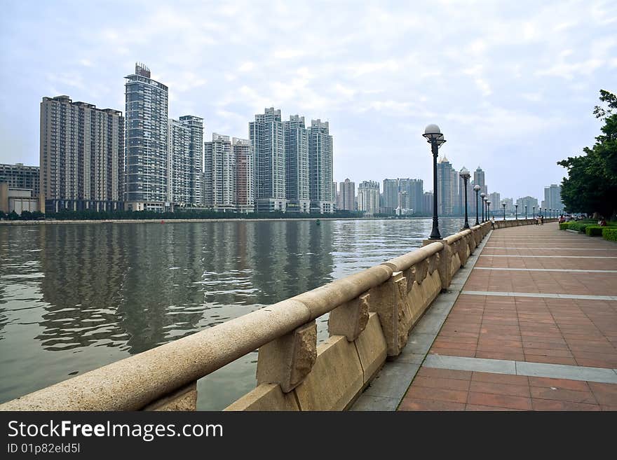 Modern residence buildings,river and embankment of city. Modern residence buildings,river and embankment of city