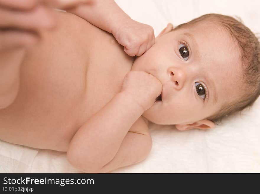 Three-month old baby girl in towel