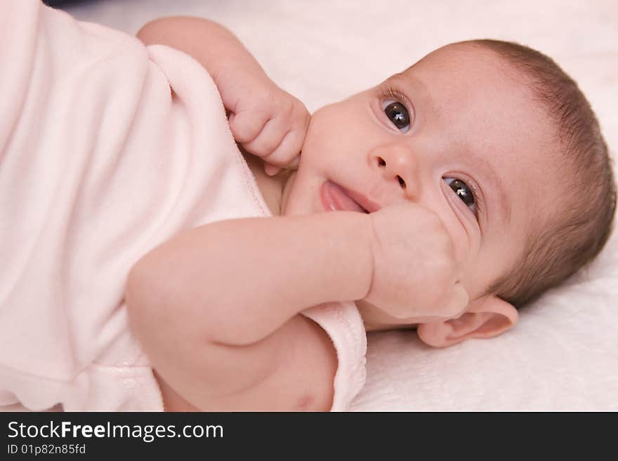 Three-month old baby girl in towel