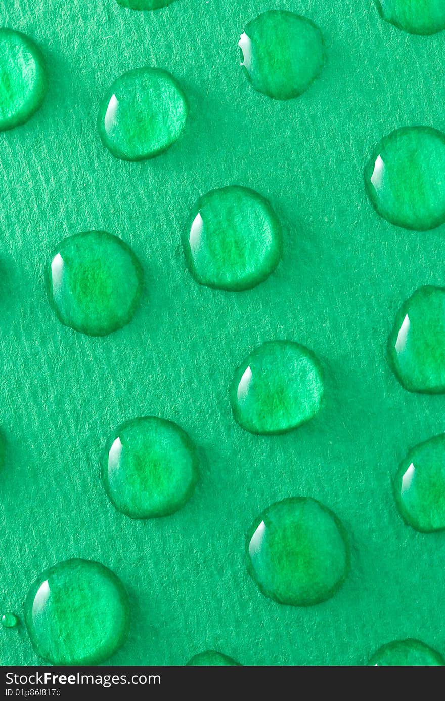 Water drops on green background. Water drops on green background