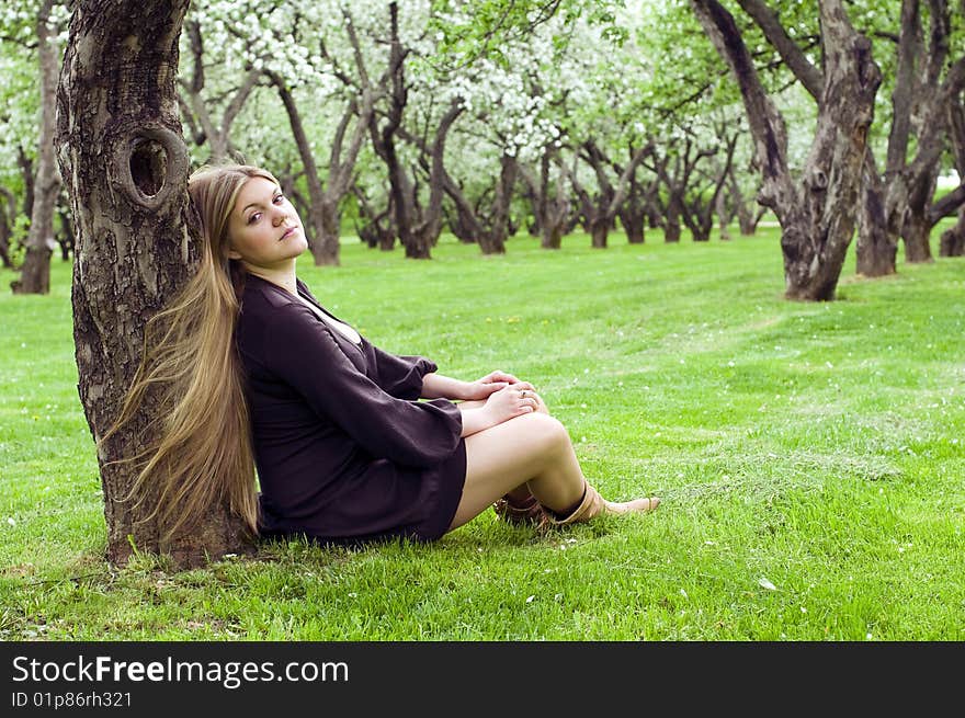 Young woman in the spring garden, day shot