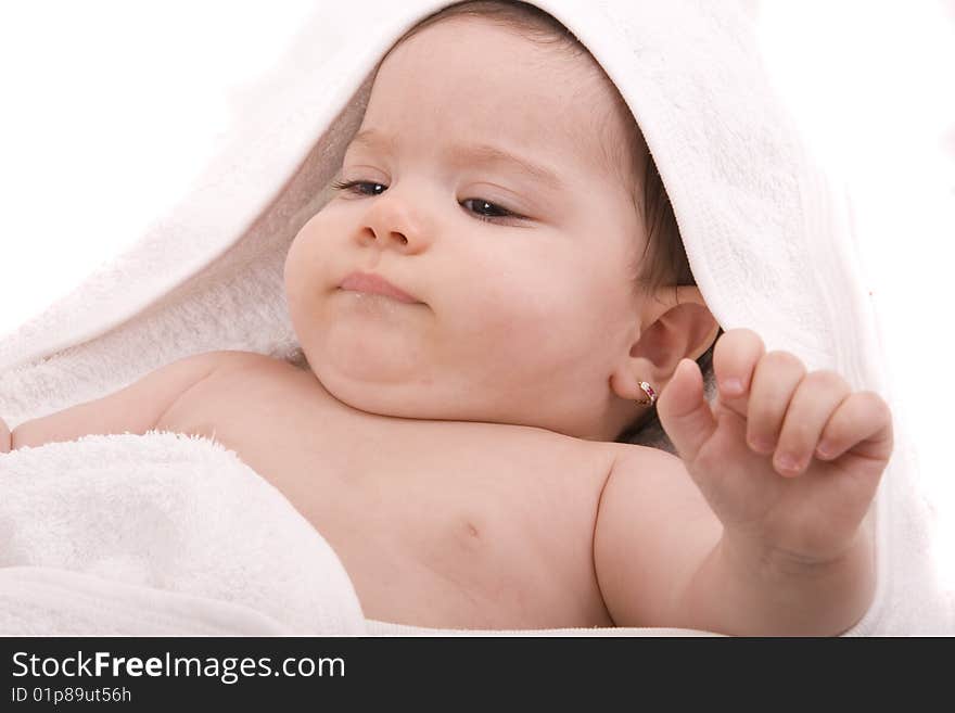 Three-month old baby girl in towel