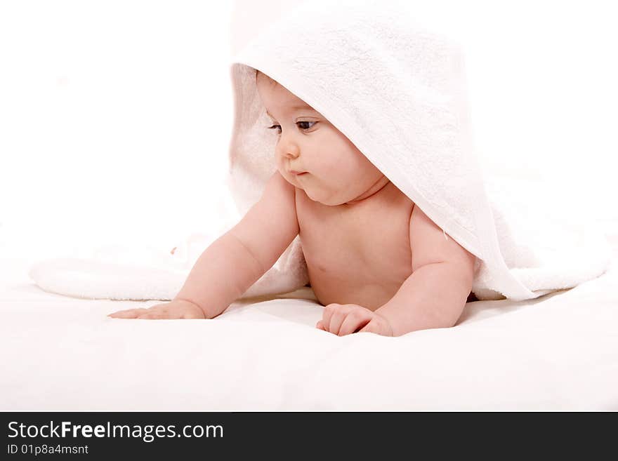 Three-month old baby girl in towel