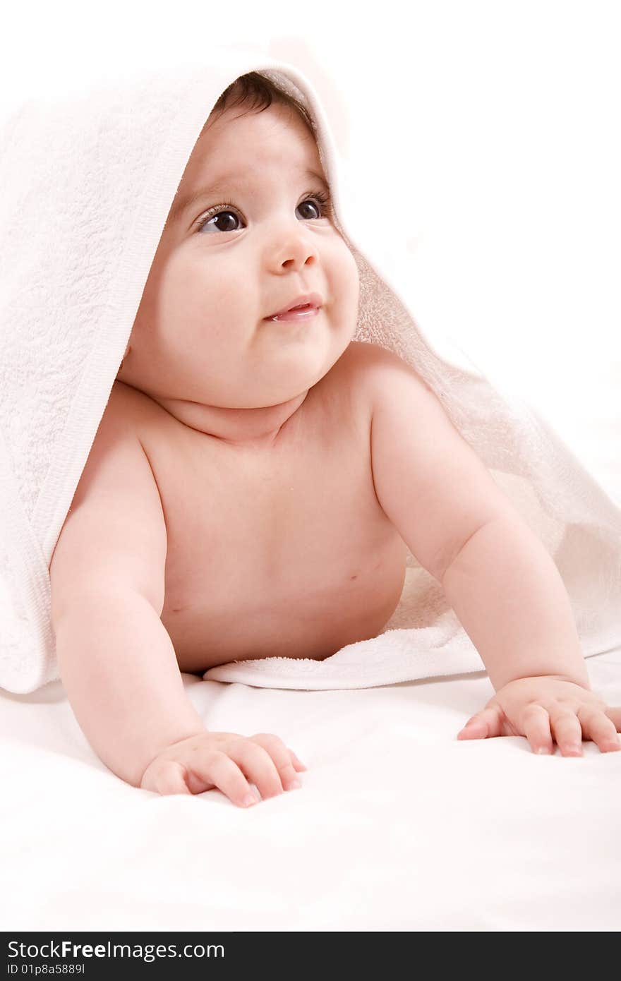 Three-month old baby girl in towel