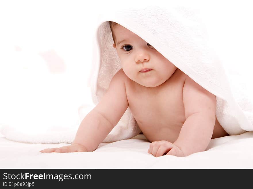 Three-month old baby girl in towel