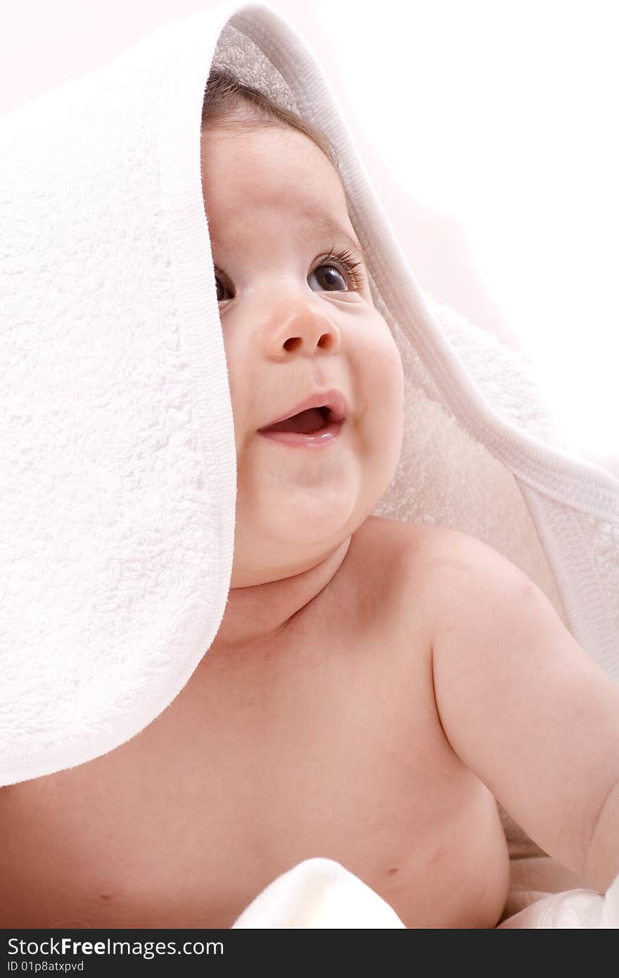 Three-month old baby girl in towel