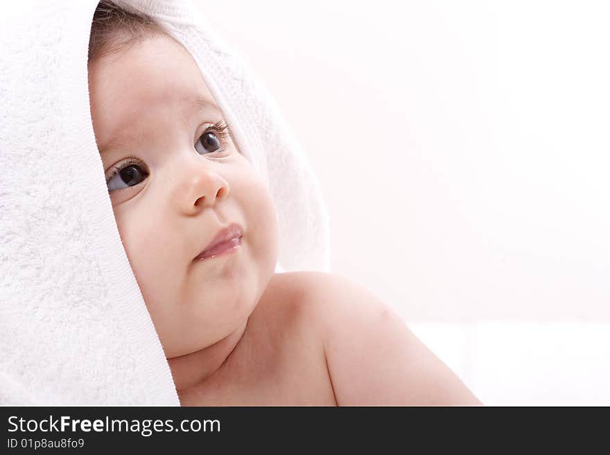 Three-month old baby girl in towel