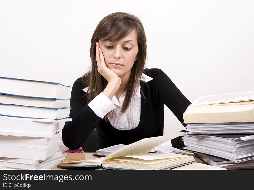 Teenage girl studying at the desk. Teenage girl studying at the desk