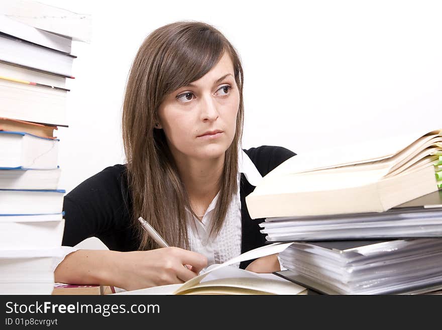 Teenage girl studying at the desk. Teenage girl studying at the desk