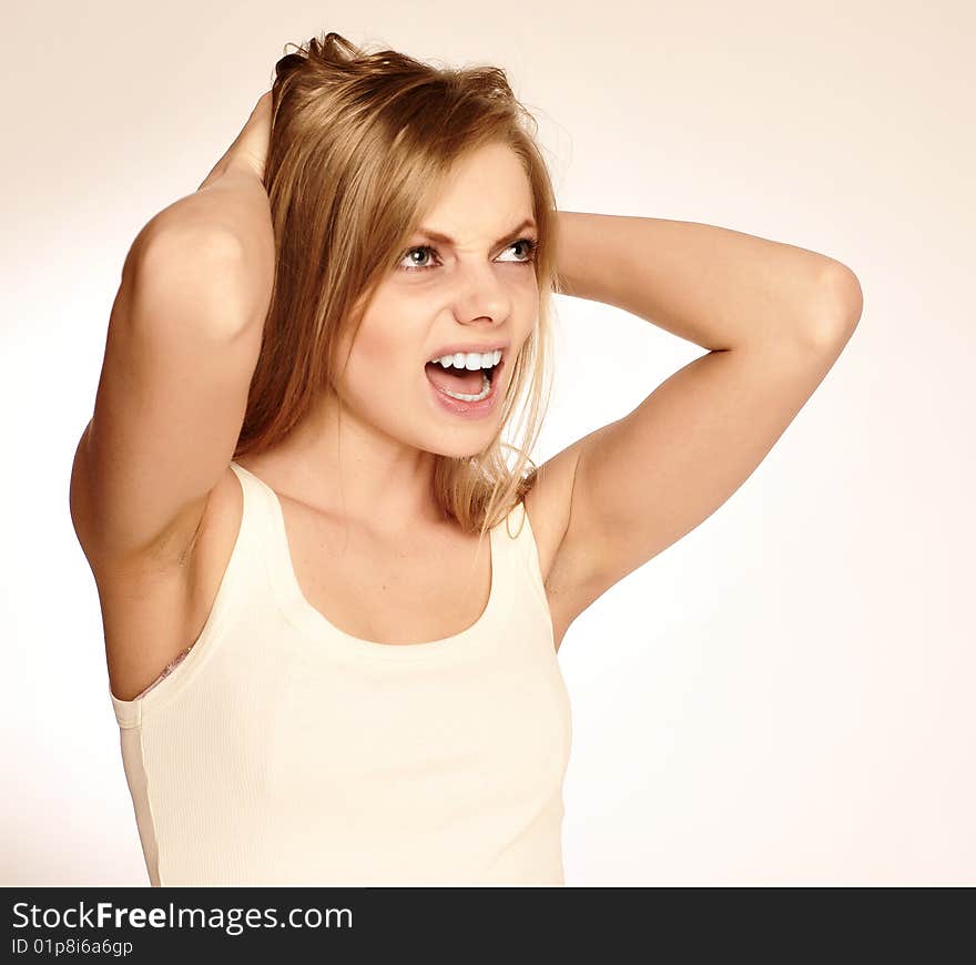 Screaming woman on light background