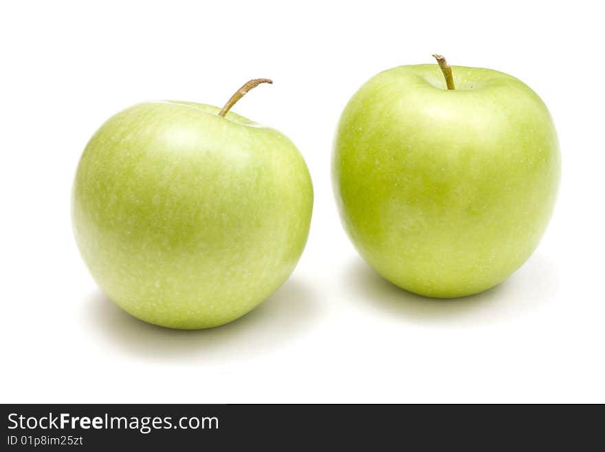 Green apples on white background