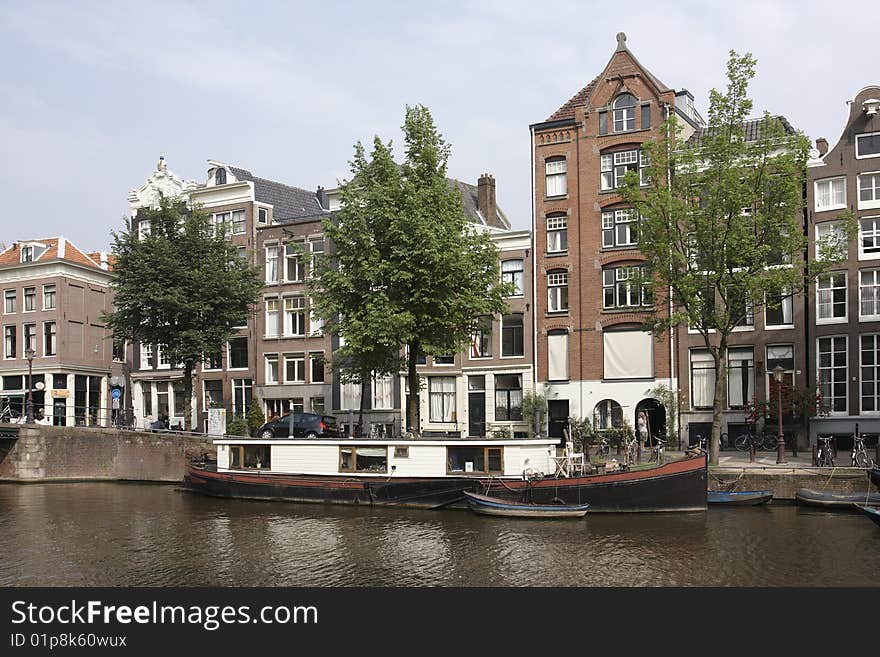 Canal scene with houseboat, Amsterdam