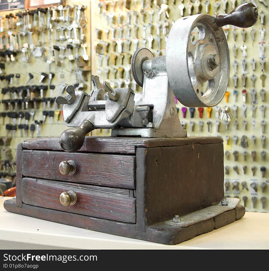 Old manual key duplicating machine in workshop