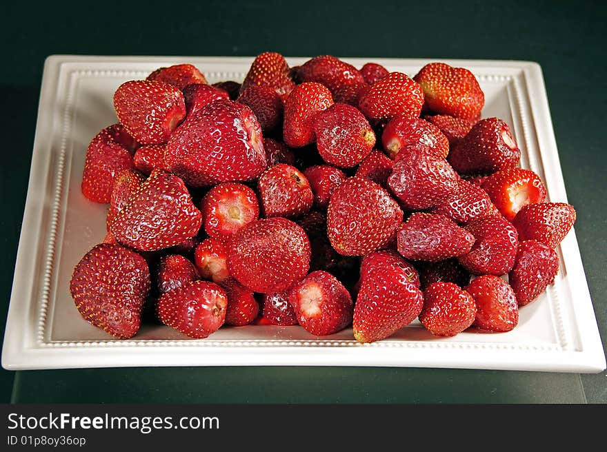 Sweet fresh strawberry on a white plate