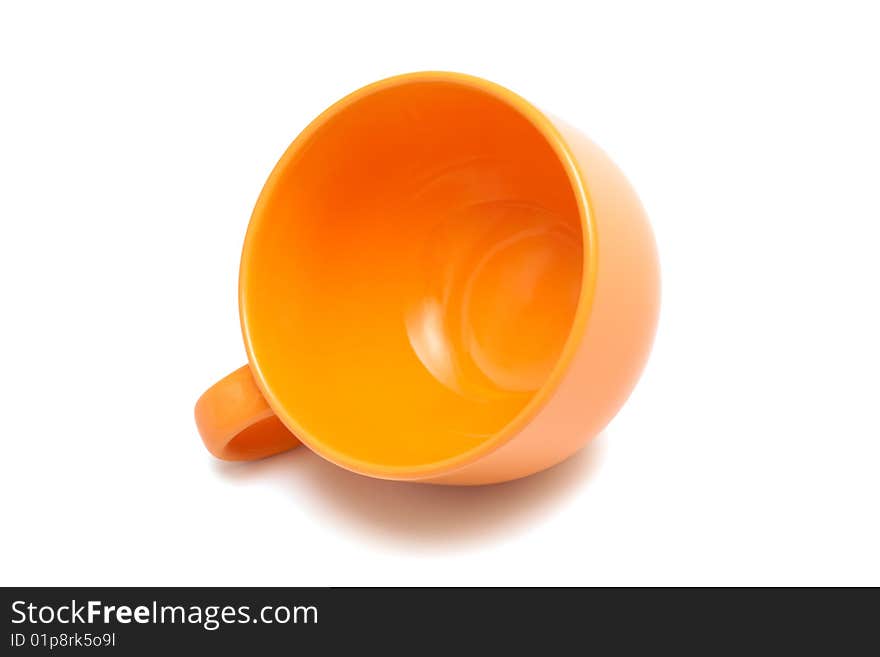 Beautiful orange cup on a white background