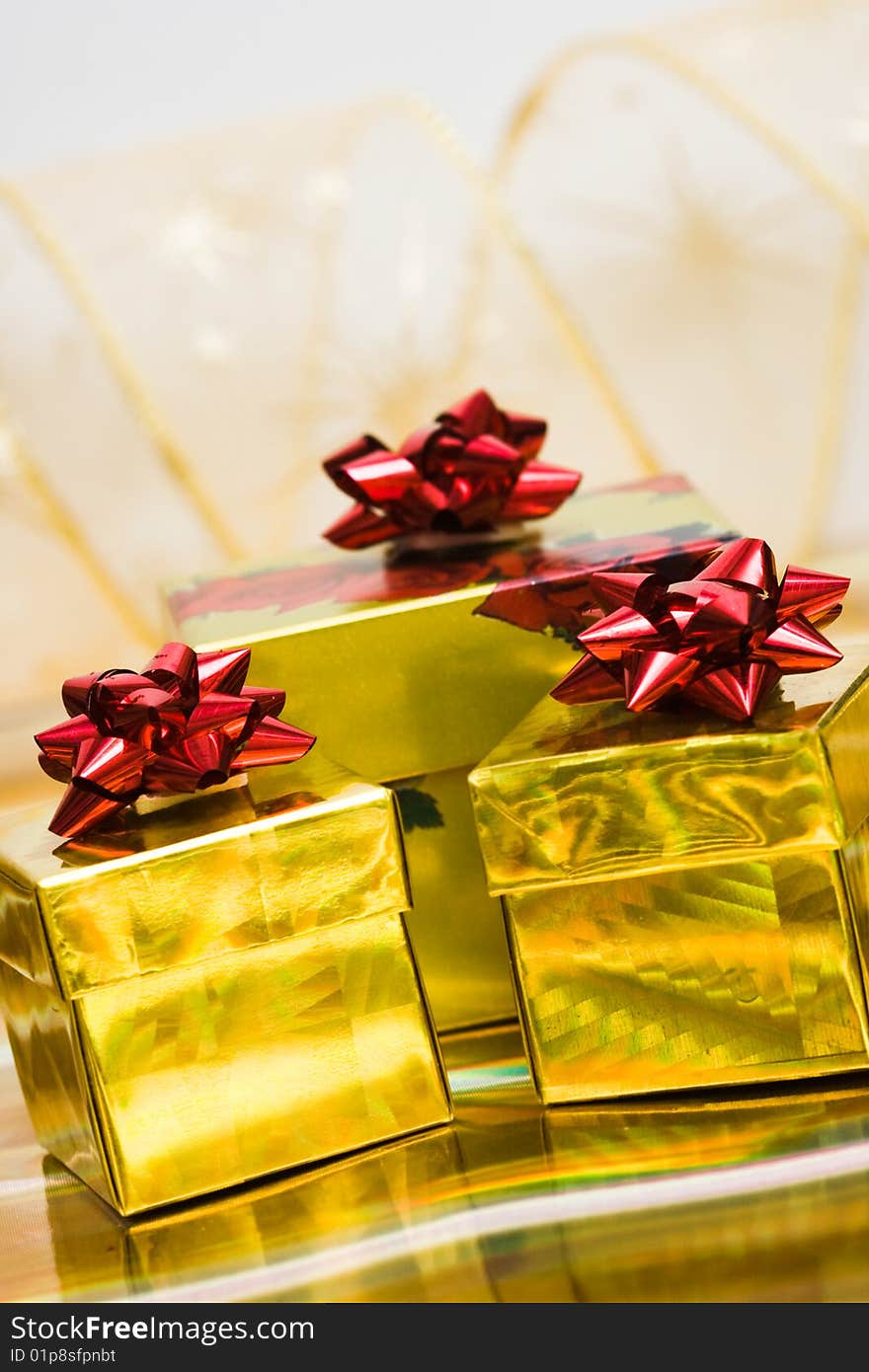 Golden gift boxes with ribbon