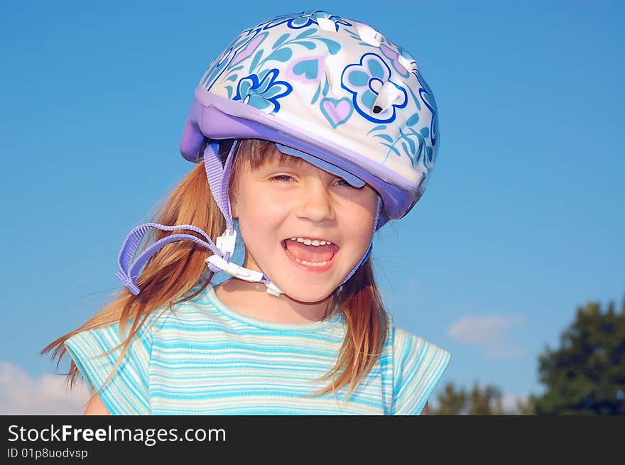 Four year old child wearing a protective helmet. Four year old child wearing a protective helmet.