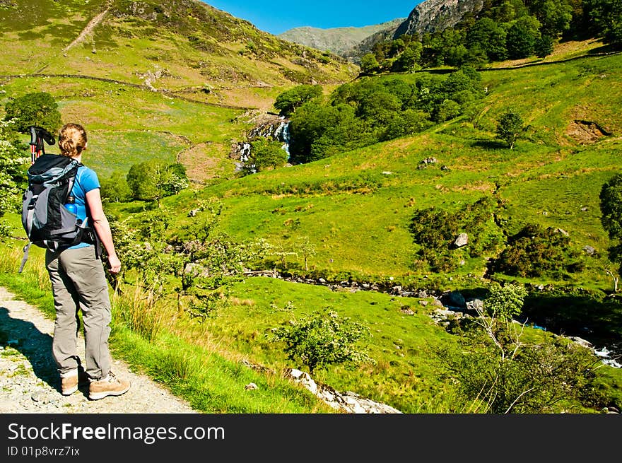 Woman looking up the Watkin Path to Snowdon ridge. Woman looking up the Watkin Path to Snowdon ridge