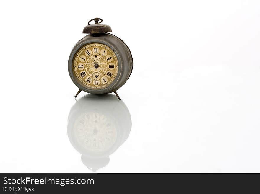 Old antique clock with reflection isolated on white background