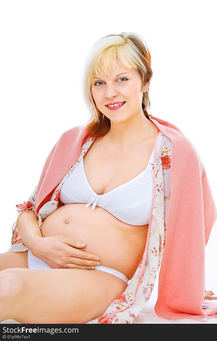 Young pregnant woman feels her baby in tummy. Young pregnant woman feels her baby in tummy