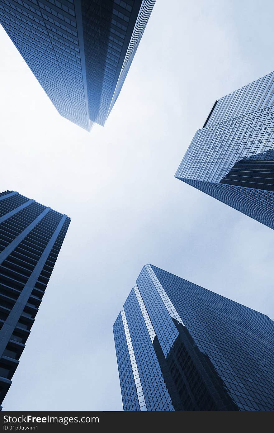 Looking up at four office towers. Looking up at four office towers