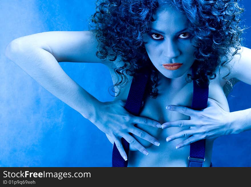 The militant woman. Portrait of girl in blue light