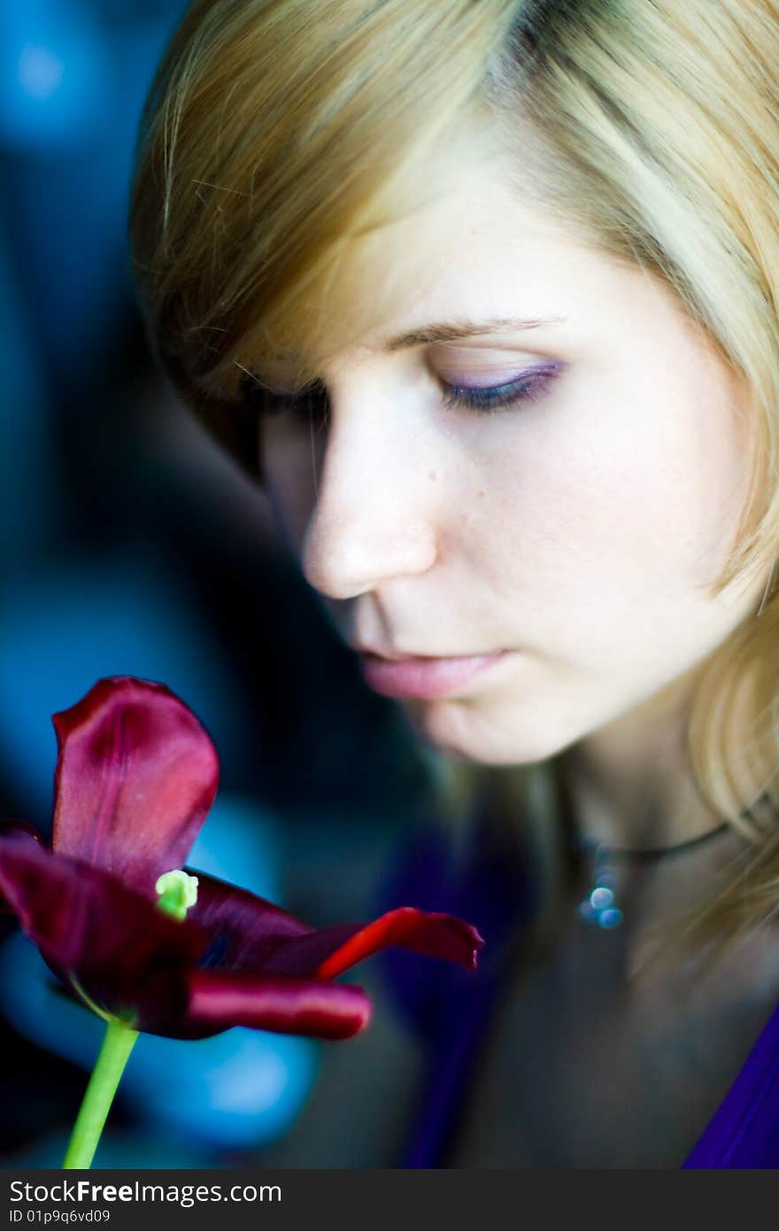 Beautiful girl with red tulip