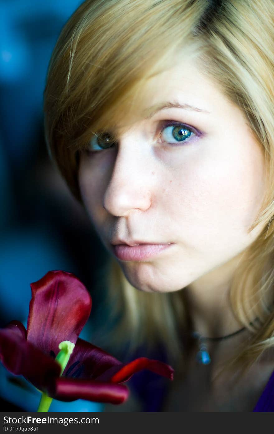 Beautiful girl with red tulip