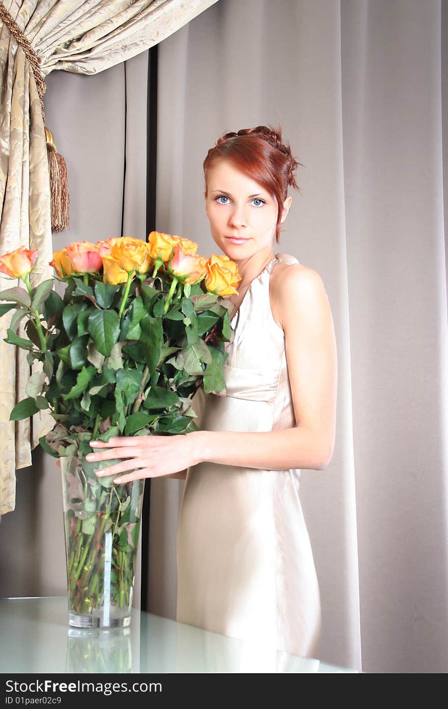 Beautiful young woman with bunch of roses. Beautiful young woman with bunch of roses