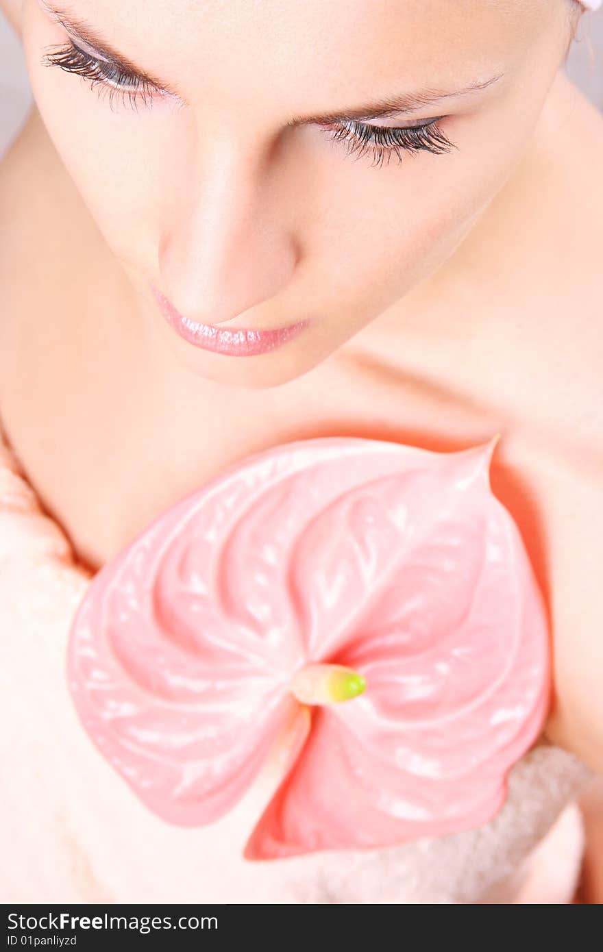 Young girl with pink flower